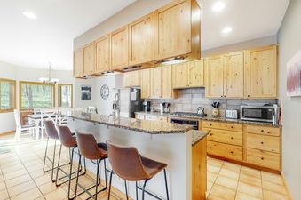 The well-appointed kitchen area at Big Moose Lodge offers modern convenience and a cozy ambiance.