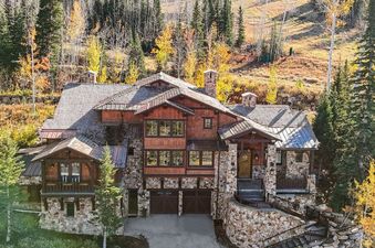 Equinox at Empire Pass showcases a luxurious mountain residence with stone and wood facade.