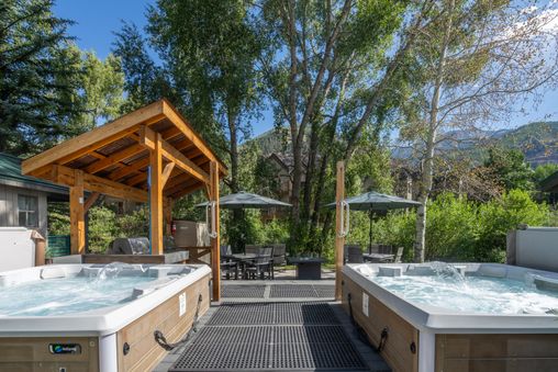 Huge complex hot tub on the patio overlooking the river