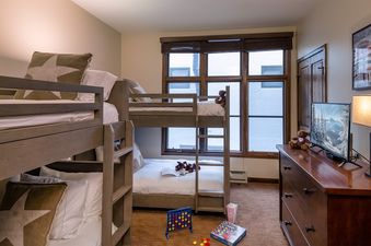 The bunk bedroom at Chalet Fortessa is set up for a comfortable stay.
