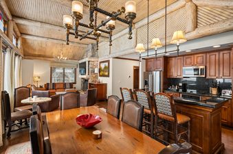 The luxurious dining and kitchen area of Ritz Carlton Club 3 Bedroom Penthouse 4302.