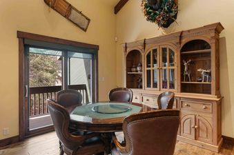 Dining area at Lakeside 1617 with a round table and chairs.
