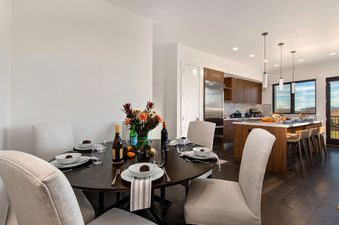 A dining table is set for a meal inside Abode at Viridian.