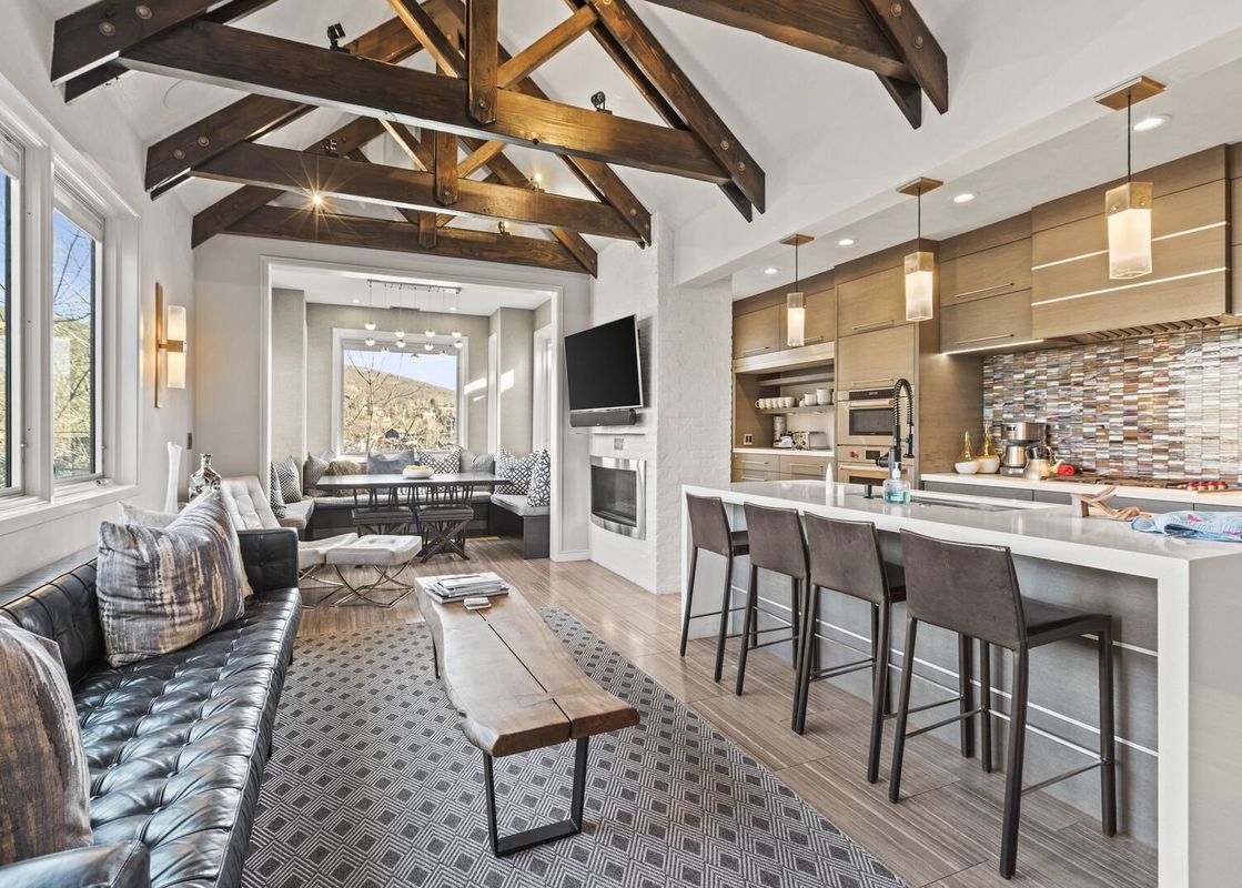 An open living space showcases the elegant interior of Abode at Powder Watch.