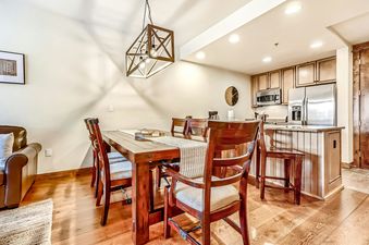 Dining table with chairs in BlueSky Breckenridge 513.