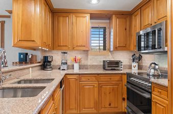 The well-equipped kitchen offers all the conveniences of home.